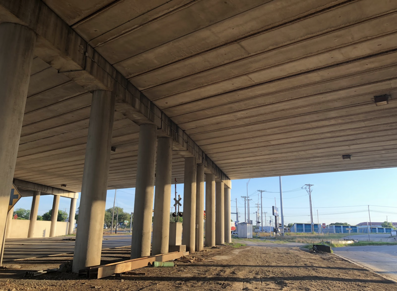 Underside of highway bridge with visible, parellel cracks designed to create bat habitat.